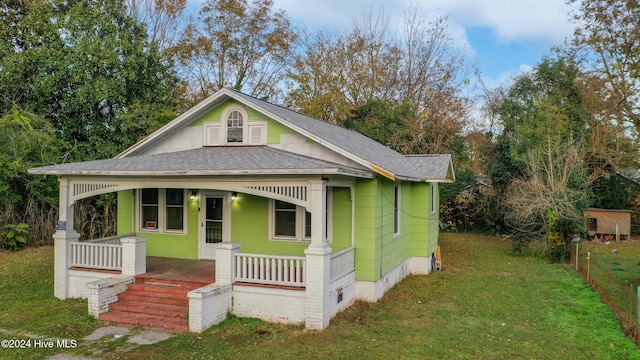 bungalow featuring a porch and a front yard