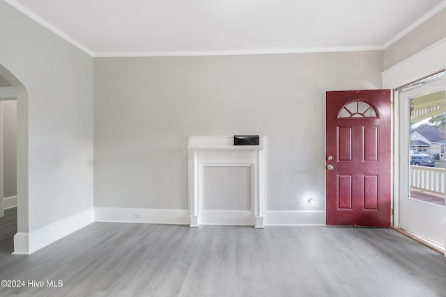 entryway featuring light hardwood / wood-style flooring and ornamental molding