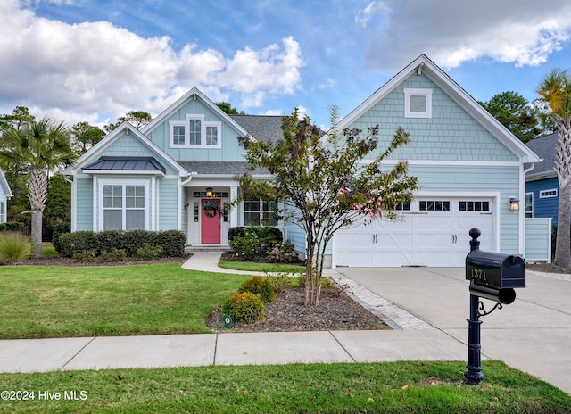 craftsman house with a front yard and a garage