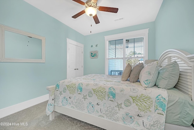 carpeted bedroom with a closet and ceiling fan