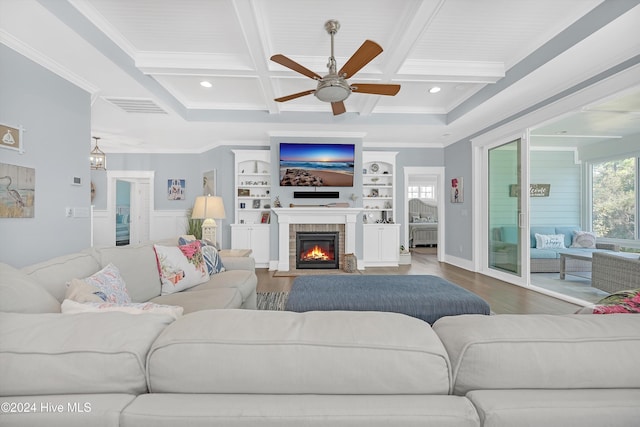 living room with beamed ceiling, wood-type flooring, ceiling fan, and coffered ceiling