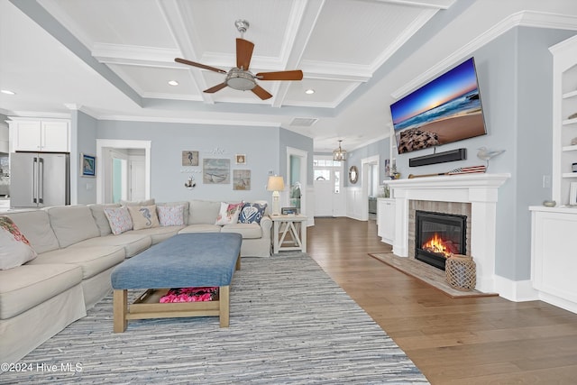 living room with coffered ceiling, ceiling fan, light wood-type flooring, ornamental molding, and beamed ceiling