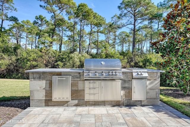 view of patio / terrace featuring area for grilling and exterior kitchen