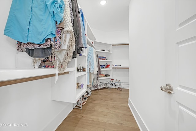 spacious closet featuring light wood-type flooring