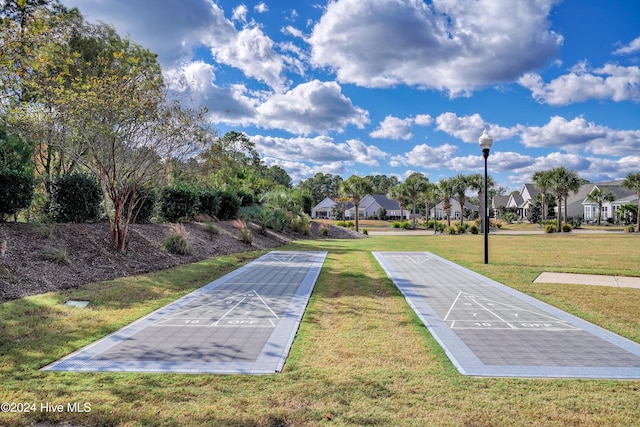 view of home's community featuring a yard