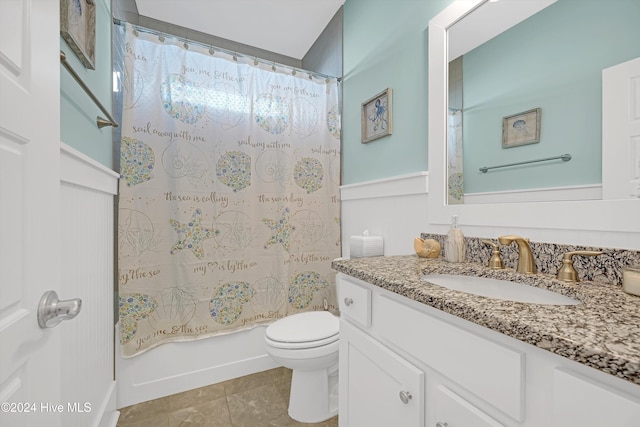 full bathroom with toilet, vanity, shower / tub combo with curtain, and tile patterned flooring