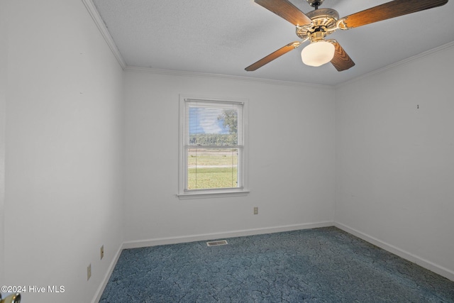 carpeted spare room featuring ceiling fan, ornamental molding, and a textured ceiling