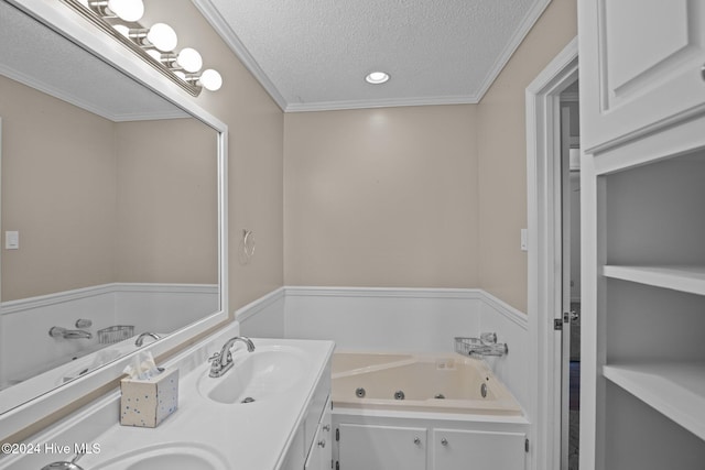 bathroom featuring a washtub, vanity, a textured ceiling, and ornamental molding