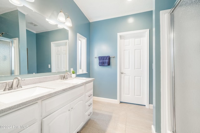 bathroom featuring tile patterned flooring, vanity, an enclosed shower, and ornamental molding