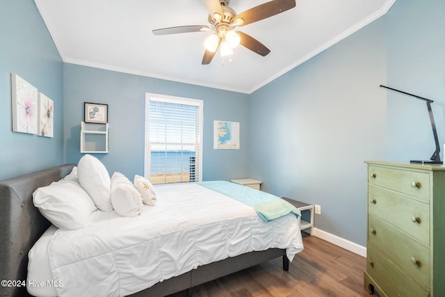 bedroom with hardwood / wood-style flooring, ceiling fan, and crown molding