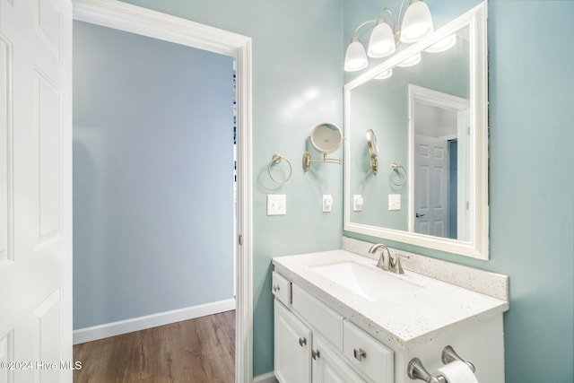 bathroom featuring vanity and hardwood / wood-style flooring