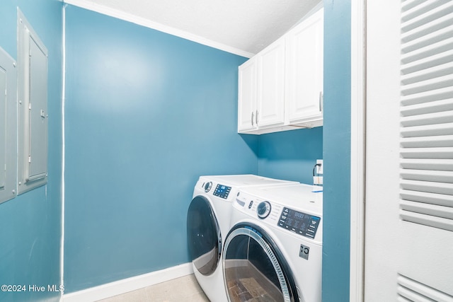 laundry room with cabinets, independent washer and dryer, crown molding, and electric panel