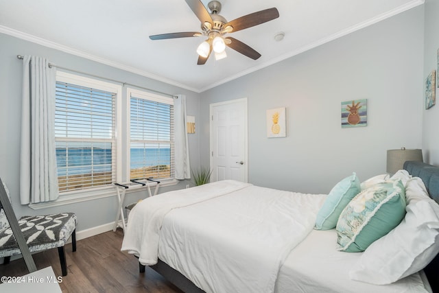 bedroom featuring ceiling fan, a water view, ornamental molding, and dark wood-type flooring