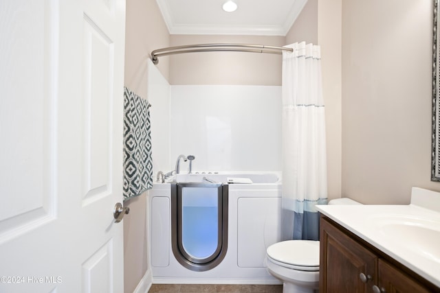 bathroom featuring toilet, vanity, a shower with shower curtain, and ornamental molding