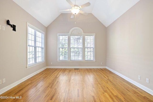 spare room featuring ceiling fan, vaulted ceiling, and light hardwood / wood-style flooring