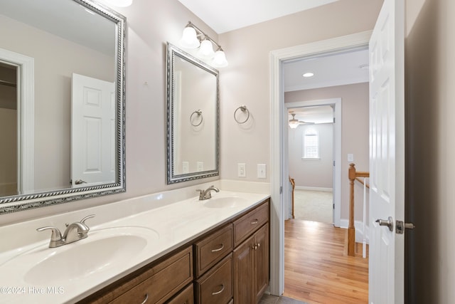 bathroom featuring vanity, hardwood / wood-style flooring, and ceiling fan