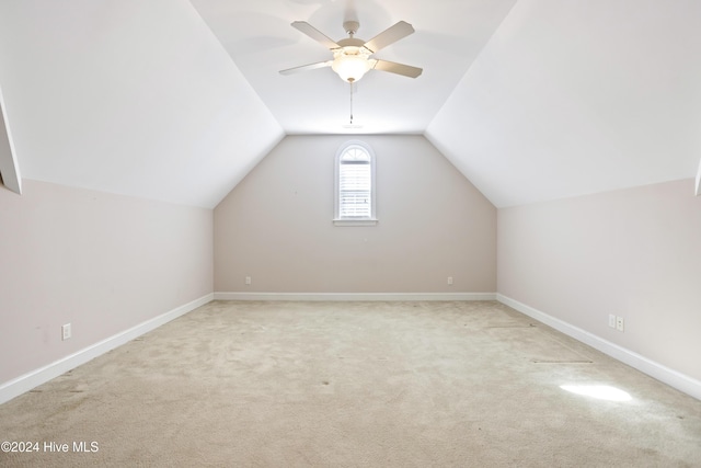 additional living space with carpet, ceiling fan, and lofted ceiling