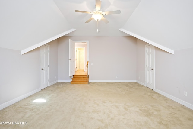 bonus room with ceiling fan, carpet floors, and lofted ceiling