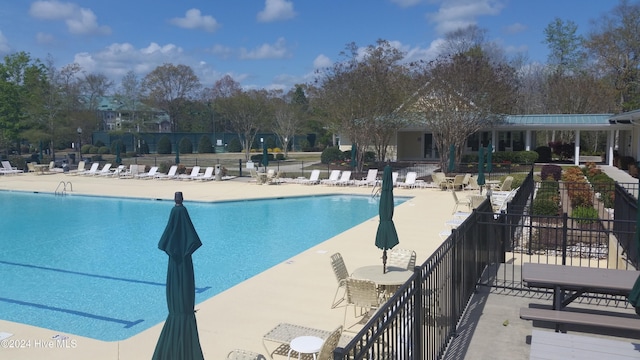 view of swimming pool with a patio