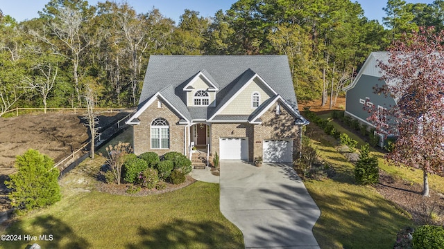 view of front facade with a garage and a front lawn