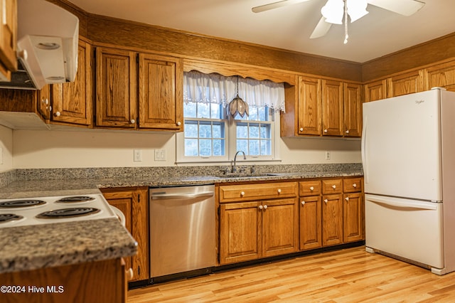 102 James Creek Rd, Southern Pines, NC 28387 - kitchen featuring freestanding refrigerator, dishwasher, a sink, brown cabinets, and light wood-style floors