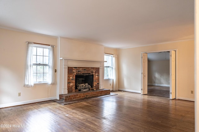 102 James Creek Rd, Southern Pines, NC 28387 - unfurnished living room with crown molding, wood finished floors, a fireplace, and baseboards