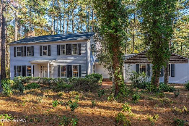 102 James Creek Rd, Southern Pines, NC 28387 - colonial inspired home featuring a chimney