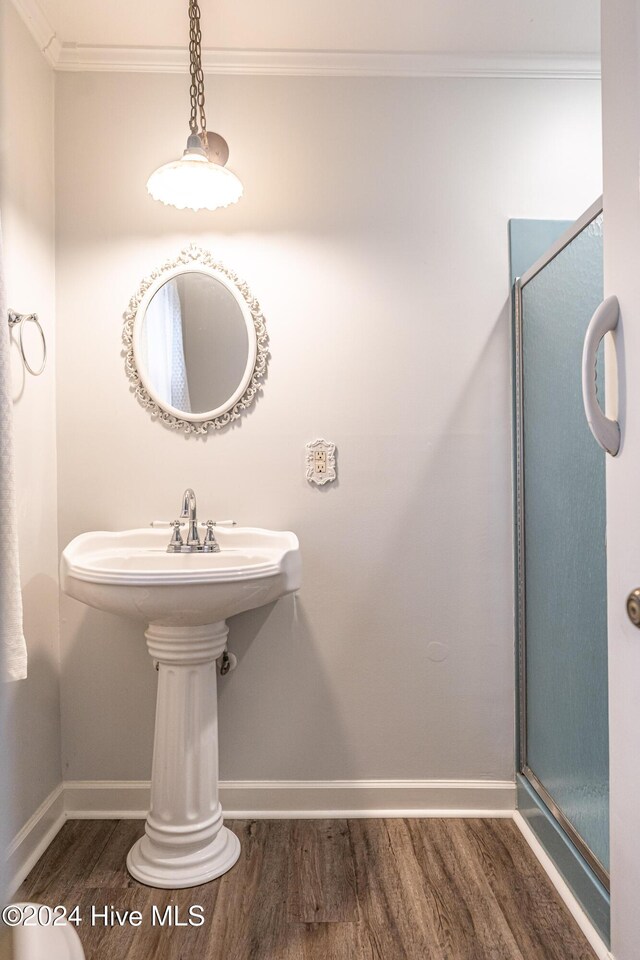 102 James Creek Rd, Southern Pines, NC 28387 - full bath featuring wood finished floors, baseboards, ornamental molding, and a shower stall