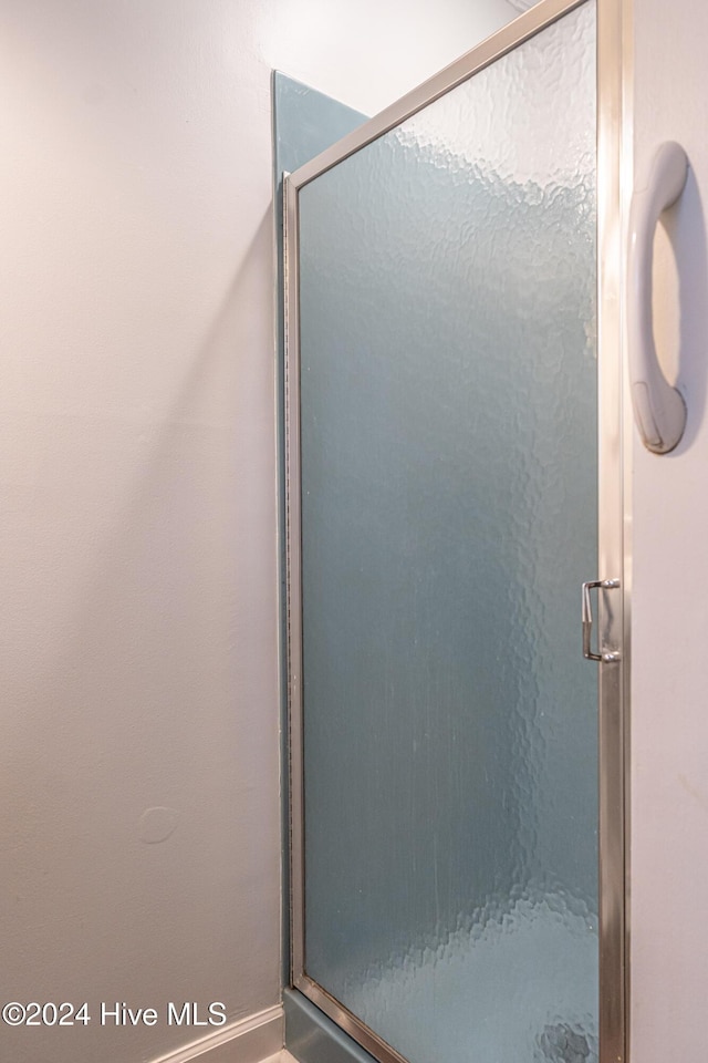 102 James Creek Rd, Southern Pines, NC 28387 - bathroom featuring a stall shower and baseboards