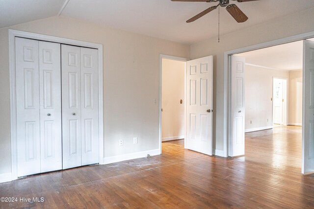 102 James Creek Rd, Southern Pines, NC 28387 - unfurnished bedroom with wood finished floors, baseboards, a closet, lofted ceiling, and a ceiling fan