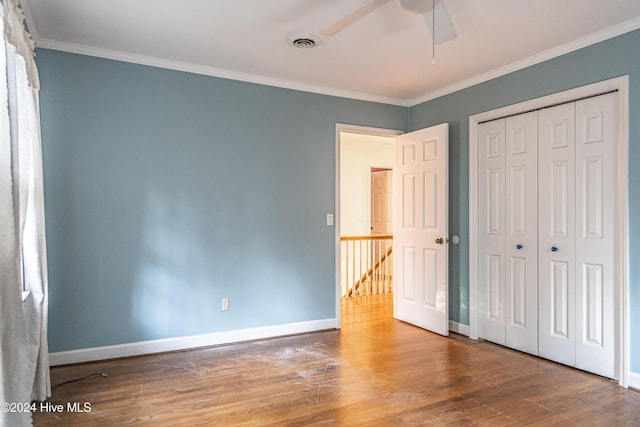 102 James Creek Rd, Southern Pines, NC 28387 - unfurnished bedroom with wood finished floors, ornamental molding, baseboards, and a closet