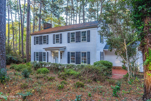 102 James Creek Rd, Southern Pines, NC 28387 - colonial home with a chimney and roof with shingles