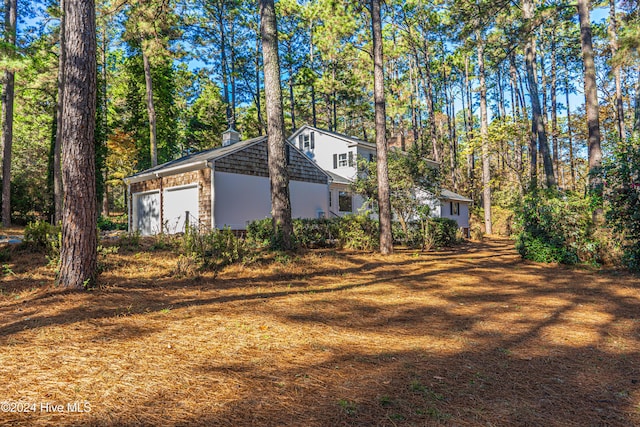 102 James Creek Rd, Southern Pines, NC 28387 - view of property exterior with an attached garage