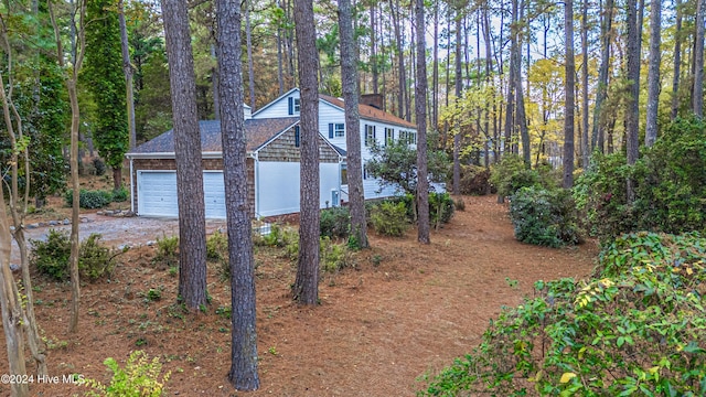 102 James Creek Rd, Southern Pines, NC 28387 - view of side of property with dirt driveway and a garage