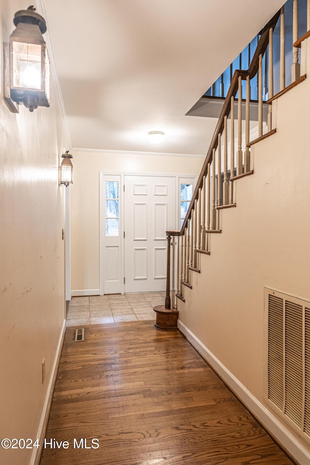 102 James Creek Rd, Southern Pines, NC 28387 - foyer with ornamental molding, wood finished floors, stairway, and baseboards