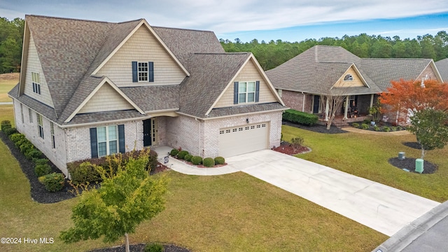 craftsman-style house with a front yard and a garage