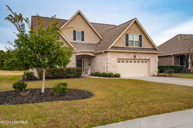 craftsman-style house featuring a garage and a front lawn