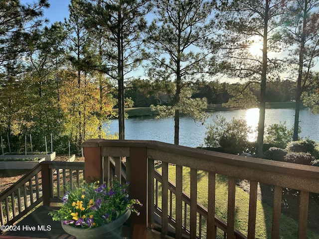 wooden deck featuring a water view