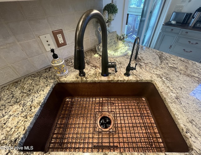 interior details with tasteful backsplash and sink