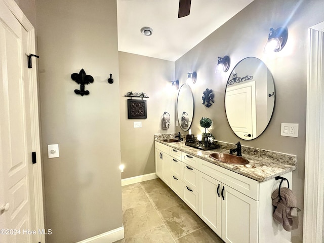 bathroom featuring ceiling fan and vanity