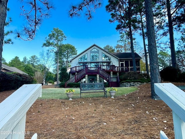 back of house with a wooden deck