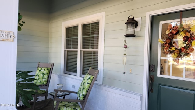 doorway to property featuring a porch