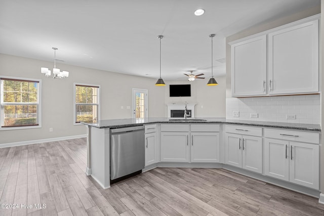 kitchen featuring dishwasher, white cabinets, light hardwood / wood-style floors, and ceiling fan with notable chandelier