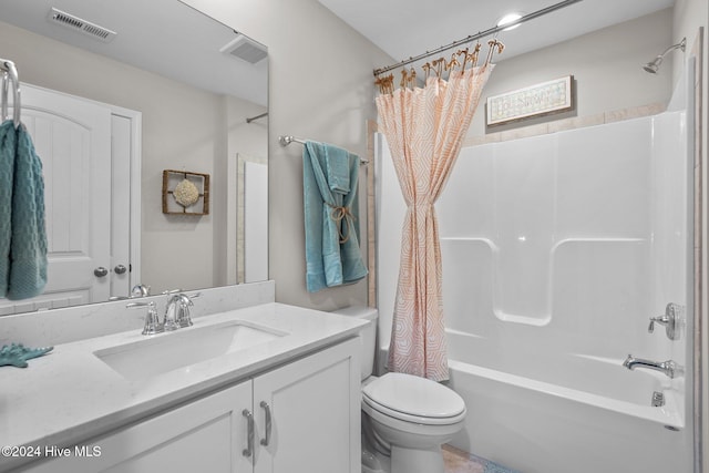 full bathroom featuring shower / tub combo with curtain, vanity, and toilet