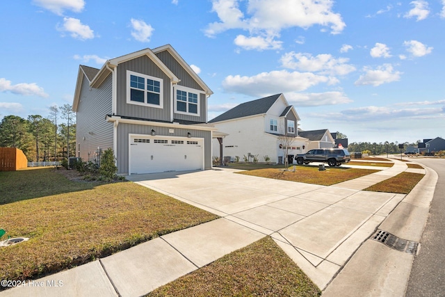 view of front of property with a front yard and a garage