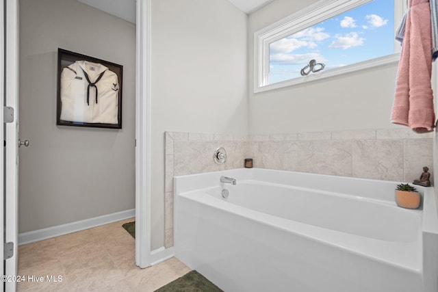 bathroom featuring tile patterned floors and a bathing tub