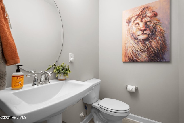 bathroom featuring sink and toilet