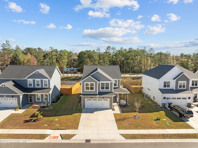 front of property with a garage and a front lawn