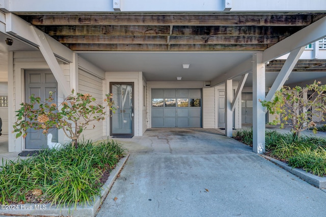 doorway to property featuring a carport