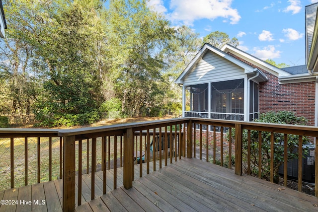 deck with a sunroom